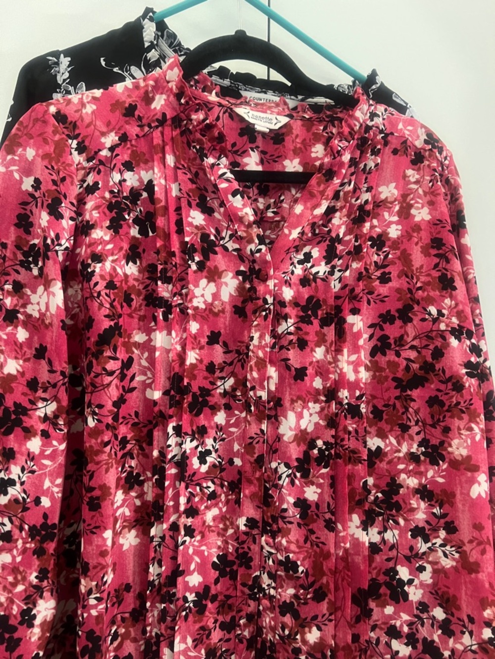 Pink Floral Pleated V-Neck Blouse and black and white V-neck blouse
